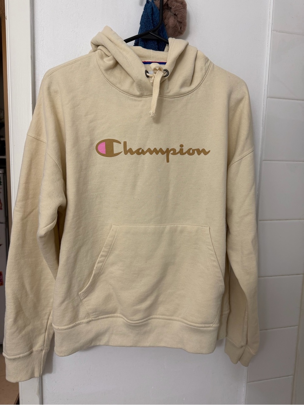 Champion Cream Pullover Hoodie with Brown Logo and Pink Accent